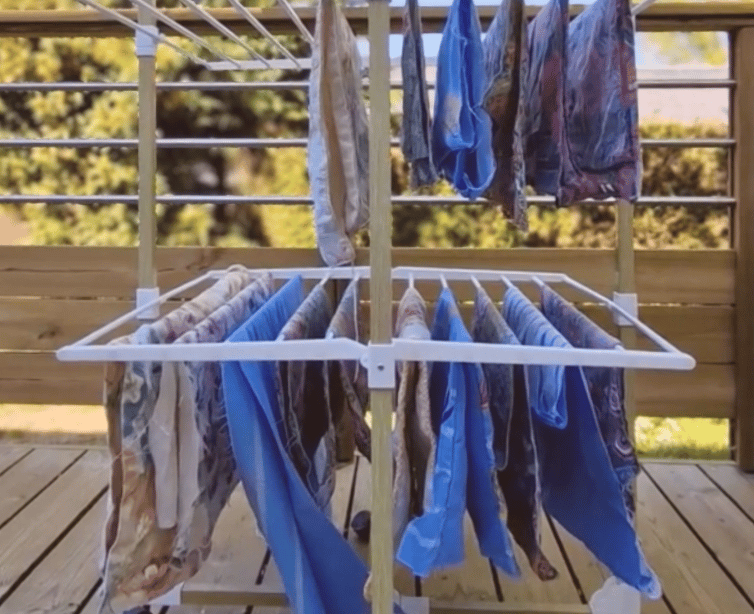 a clothes rack with clothes hanging on it