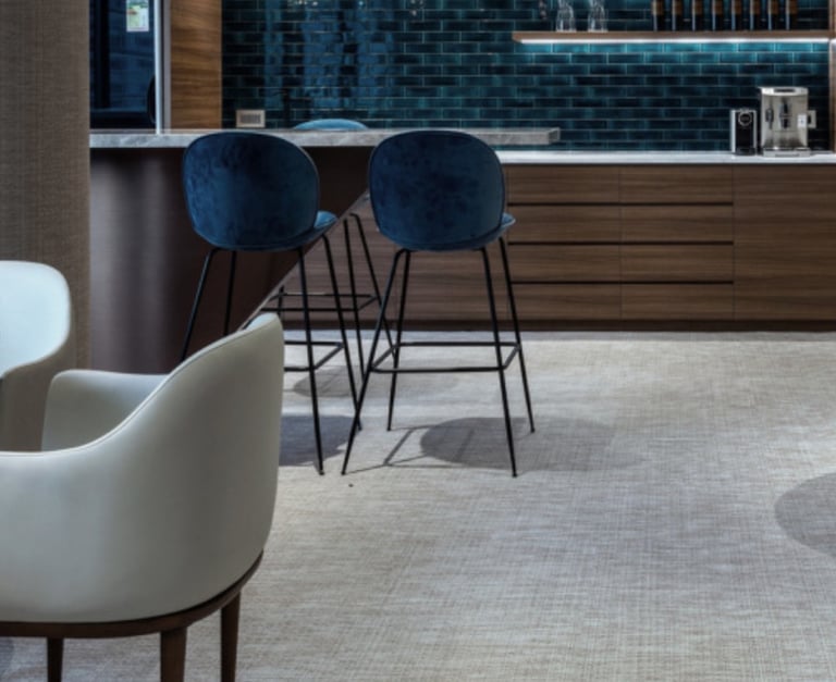 a modern looking bar with a bar stool and a bar stool