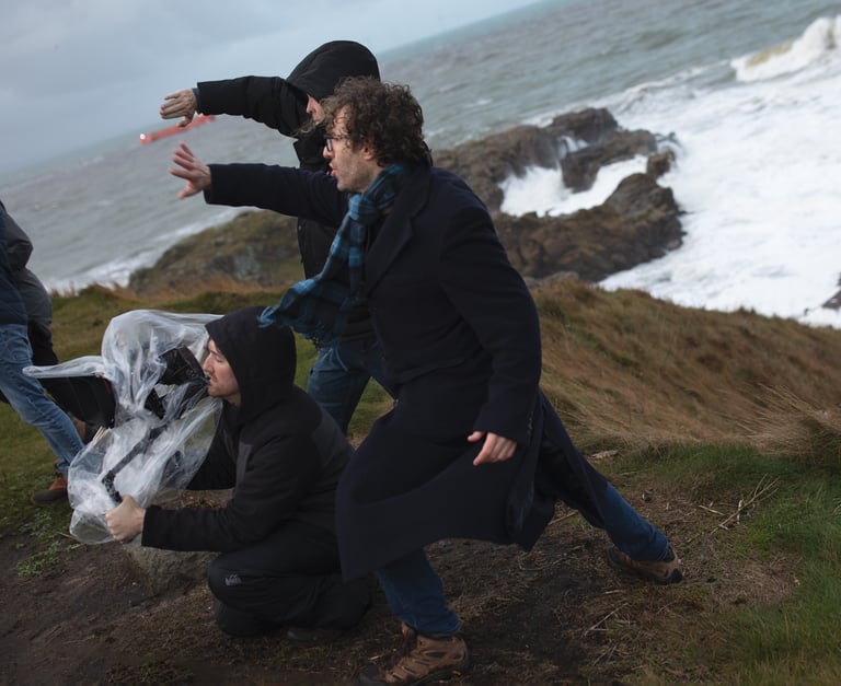 Production company staff directing a film on set