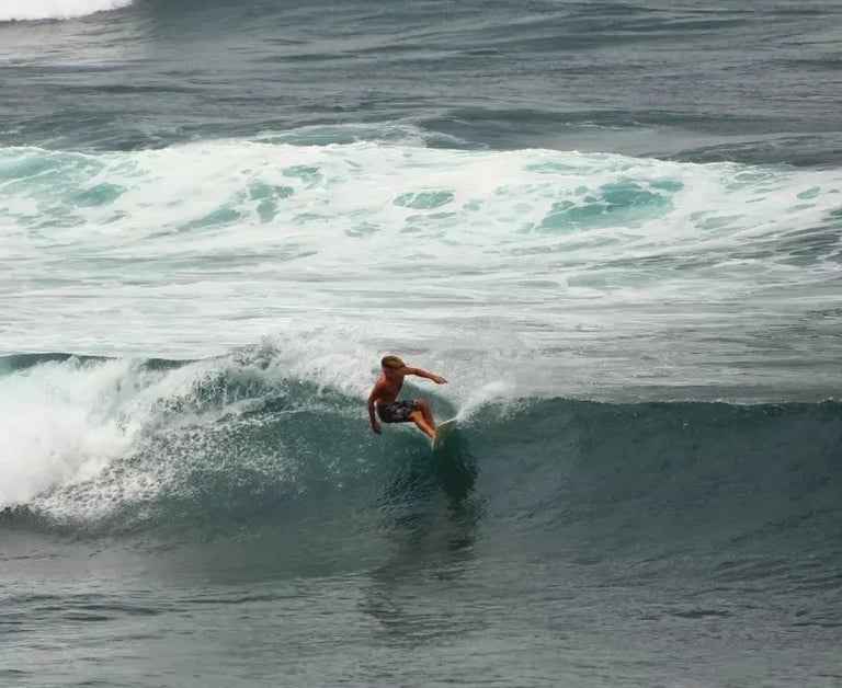 surfer at popoyo beach on a wave