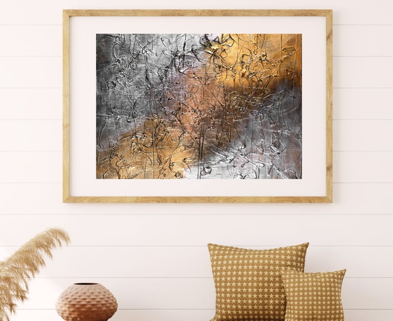 Neutral abstract painting with silver and golden bronze textures — featured in a cozy, boho-inspired