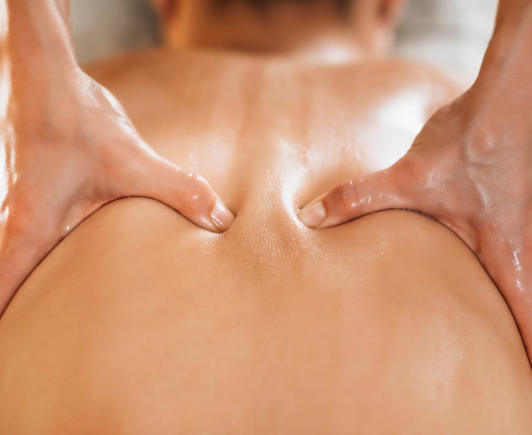 a woman having her back massaged