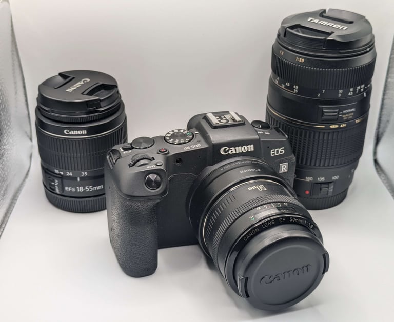 Up-close shot of Canon EOS RP & a few lenses