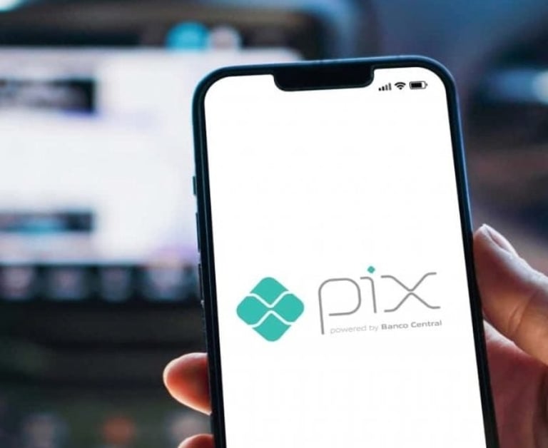 a person holding a phone with a phone in their hand