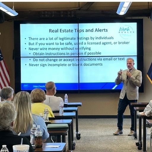 Brian is talking at a real estate tips event