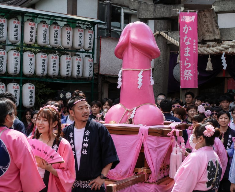 A large pink phallic statue carried on a mikoshi during the Kanamara Matsuri festival in Kawasaki, Japan.
