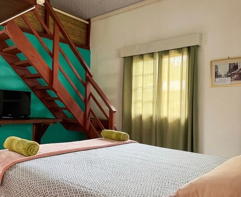 Cozy room with mountain views at Rainforest Yasmin Inn in Santa Fe Veraguas.