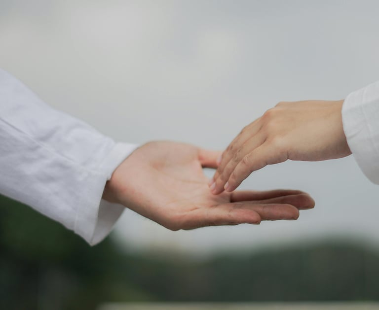 a person holding a hand with a hand holding a hand