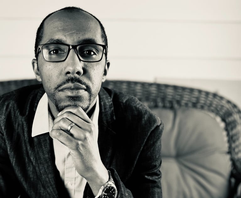 Portrait of J Allen Phelps, author of "The Girl No Boy Could love," exuding creativity and warmth. 