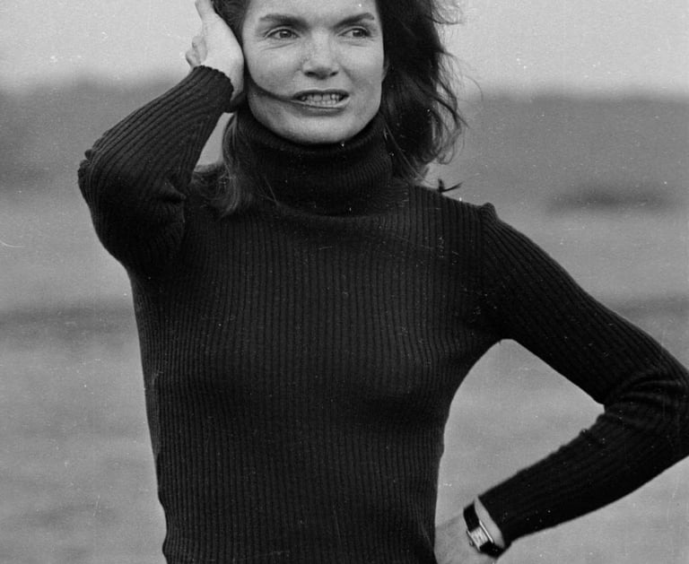 Jacqueline Kennedy wearing her signature Cartier Tank watch.