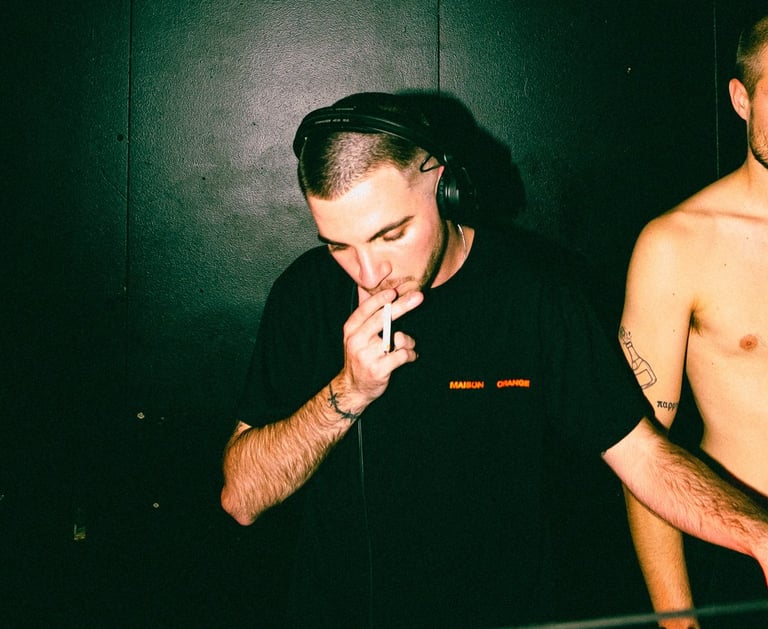 two men standing in front of a club