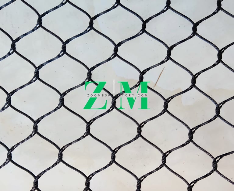 Durable black oxide stainless steel wire rope mesh for zoo enclosures and security fencing.