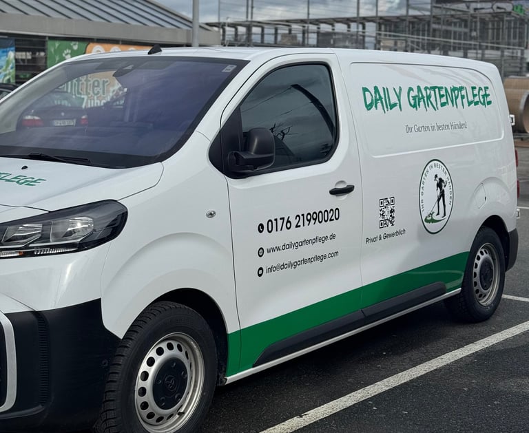 White Daily Gartenpflege commercial van parked in a lot, featuring professional gardening service branding and contact