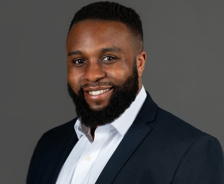 a man with a beard and a suit