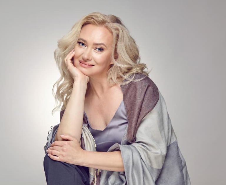 a sugar mommy in a gray dress and a scarf