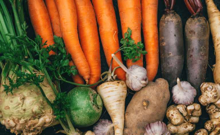 A selection of root crops - carrots, parsnips, beets, and more!
