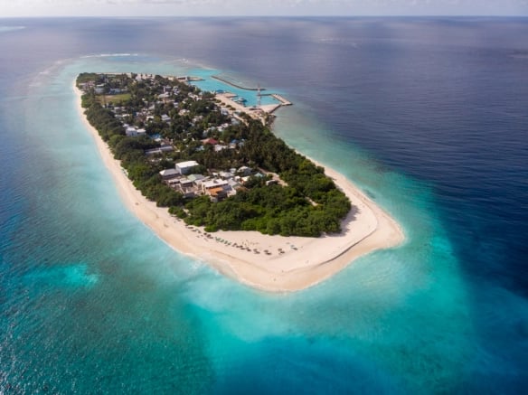 a small island with a small island in the middle of the ocean