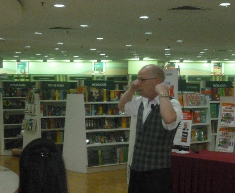 rob hamilton author romani reader explaining mental blocks at a book signing