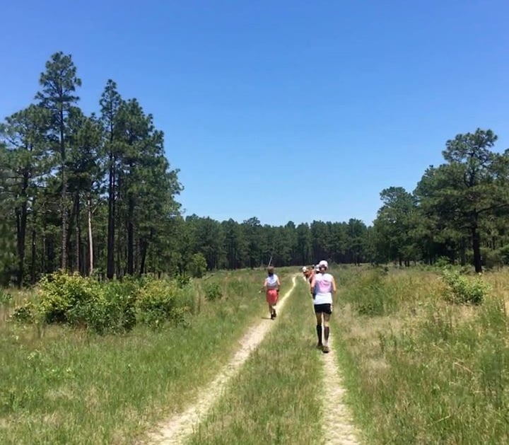 Ultra runners on grassy course