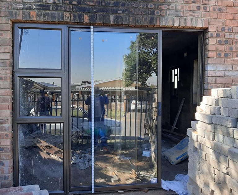 bronze aluminium door with sidelight and clear 6.38 shatterproof glass