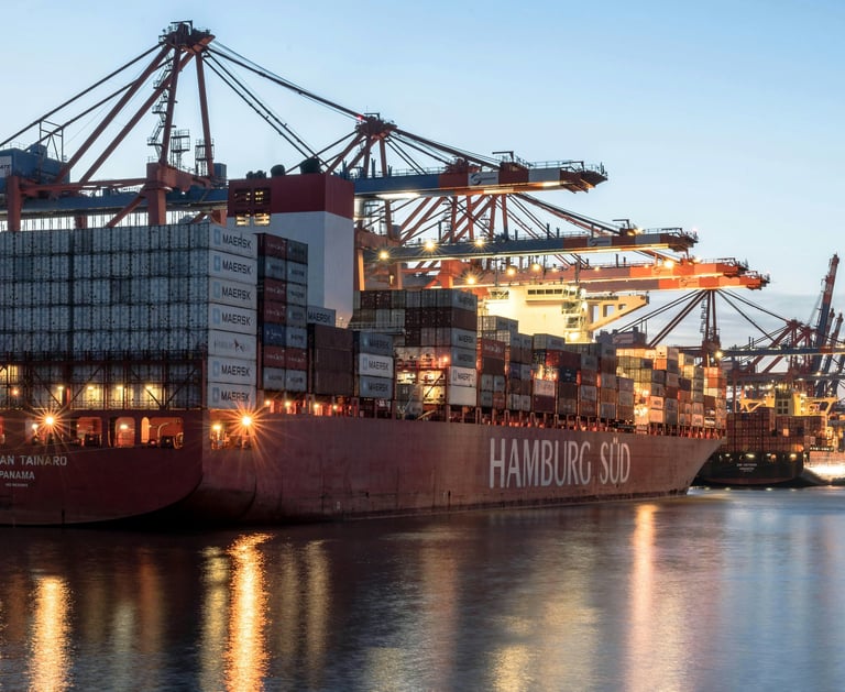 a large container ship docked at a dock