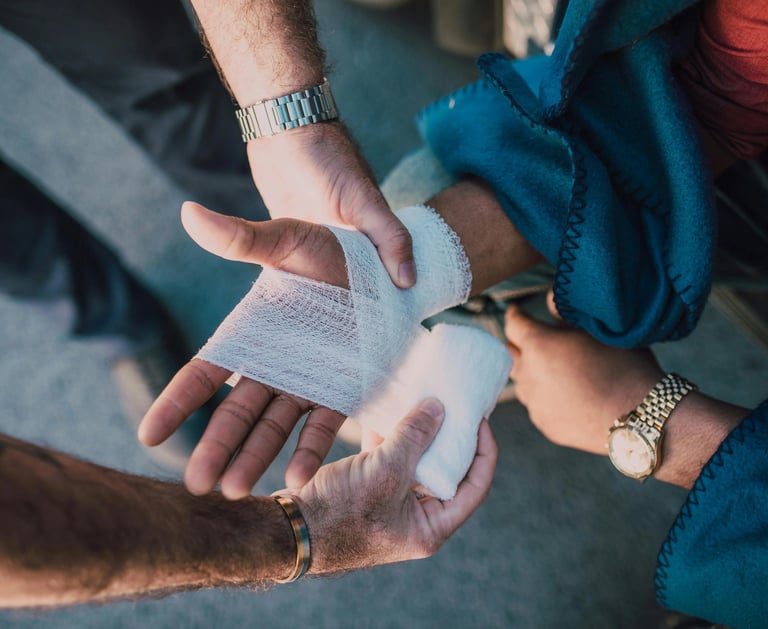 a man is holding a bandage in his hand