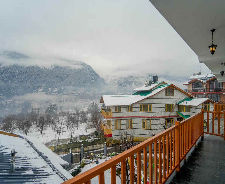 private balcony view from cottage in Manali with mountains