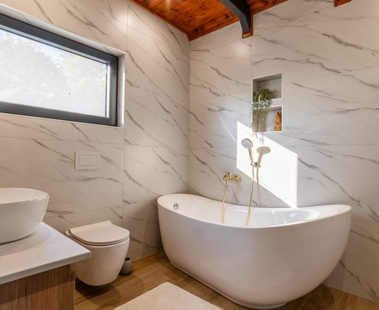 a bathroom with a tub tub and a wooden ceiling