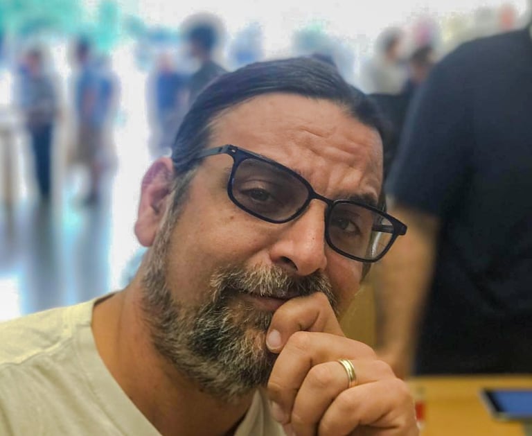 a man with a beard and glasses on his face