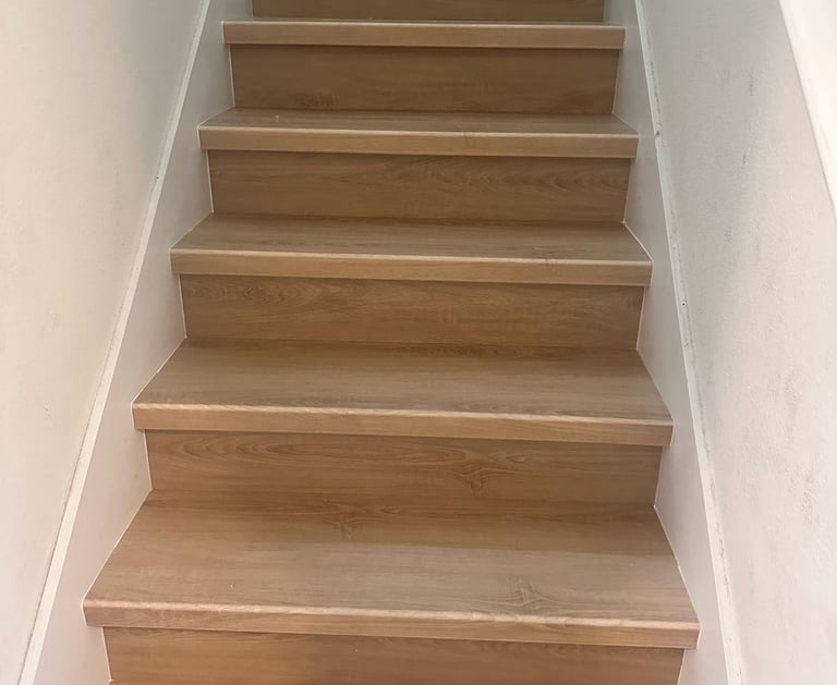 Professional flooring installation in Central Florida home with premium vinyl planks, moisture barri