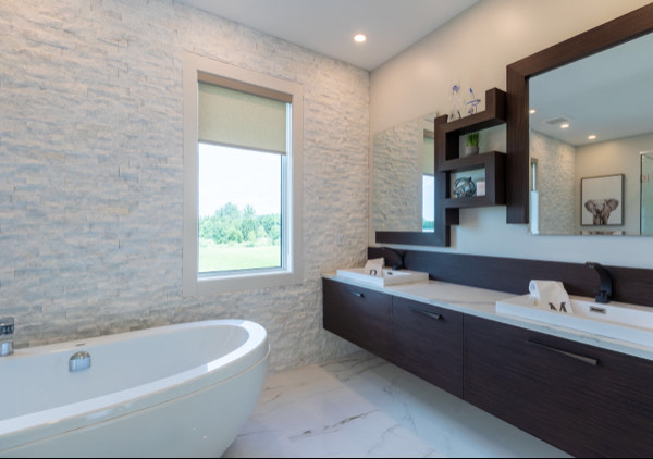 a bathroom with a tub tub and a large mirror