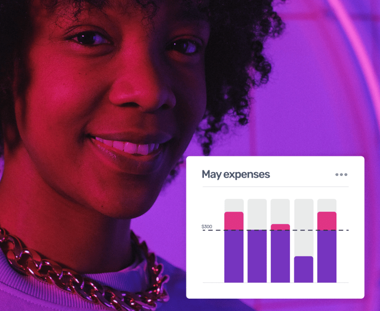 Smiling woman with curly hair viewing a digital budget tracking bar chart for monthly expenses.