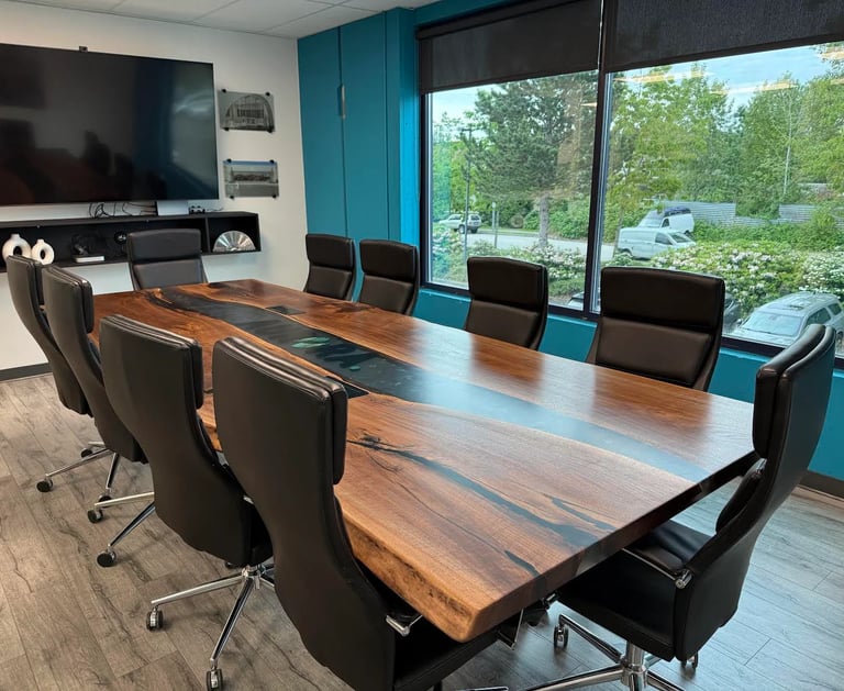 12ft x 5ft black walnut epoxy river boardroom table installed — Aurora Glass