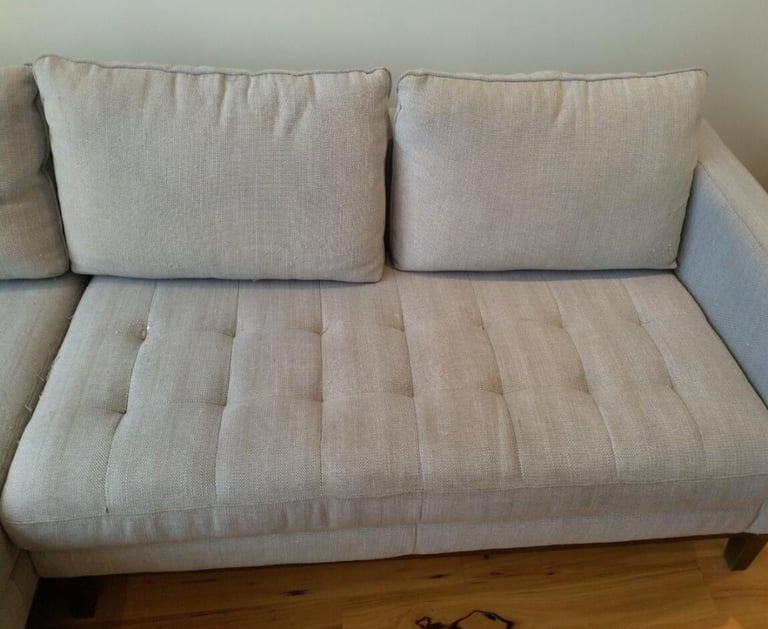 After cleaning showing a sofa visibly improved after deep cleaning.