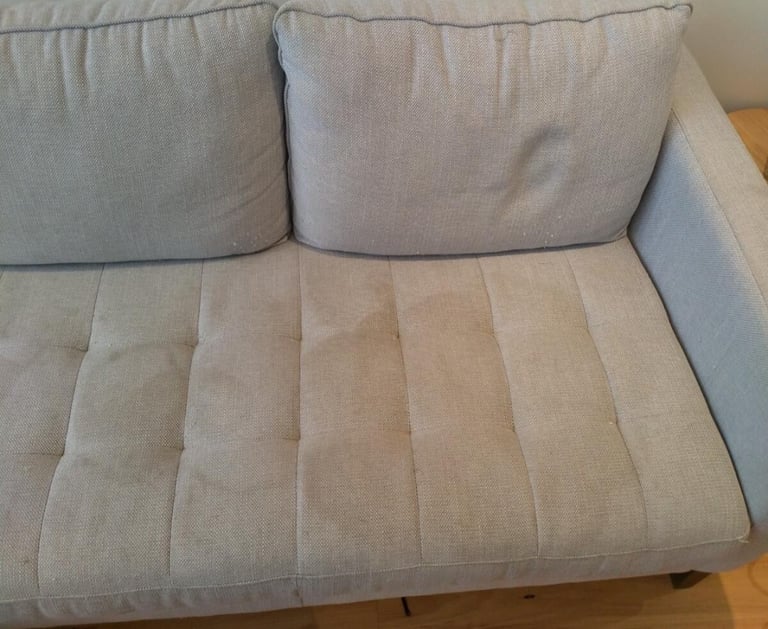 Before cleaning showing a sofa visible stain