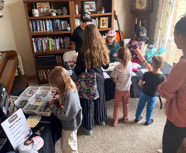people at hat making station, kids and adults