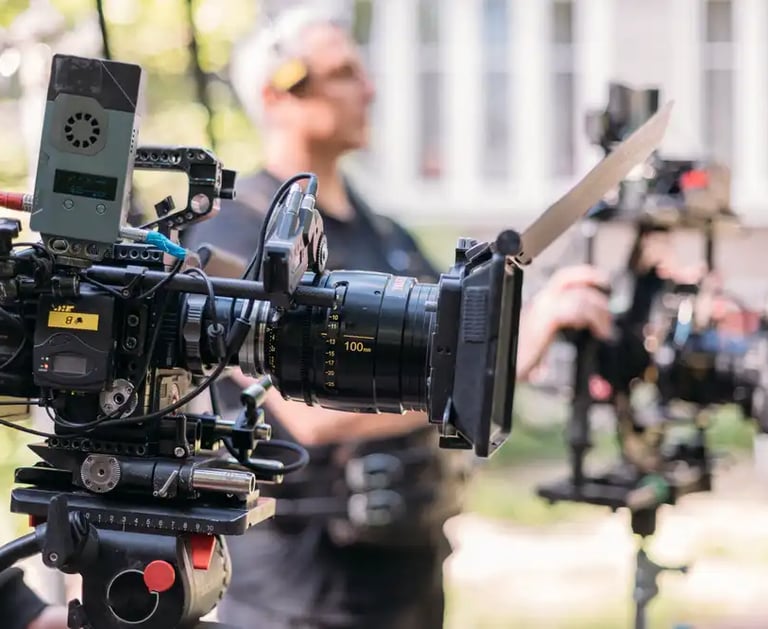 camera operator filming on location