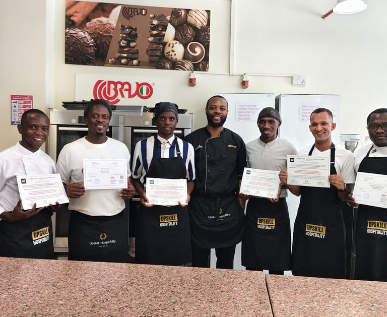 culinary training courses in UAE with chefs receiving certificates in professional kitchen