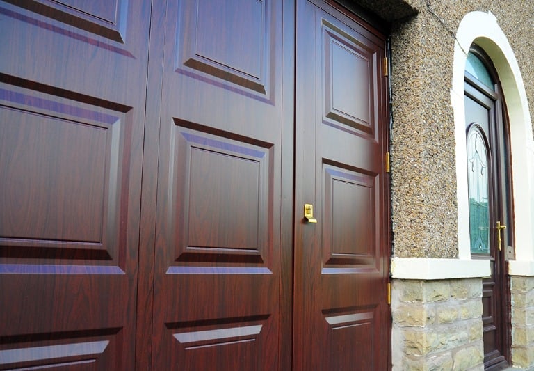 uPVC garage doors with secure locking pass door