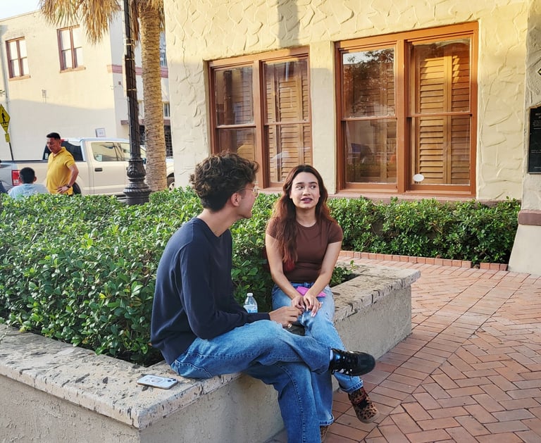 A man & a woman talking 