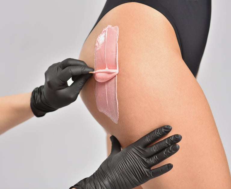 Profession waxer performing a brazilian wax on client