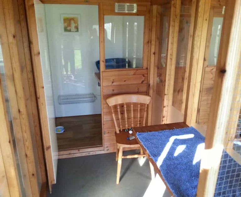 Looking into a chalet, showing the run and sleeping area