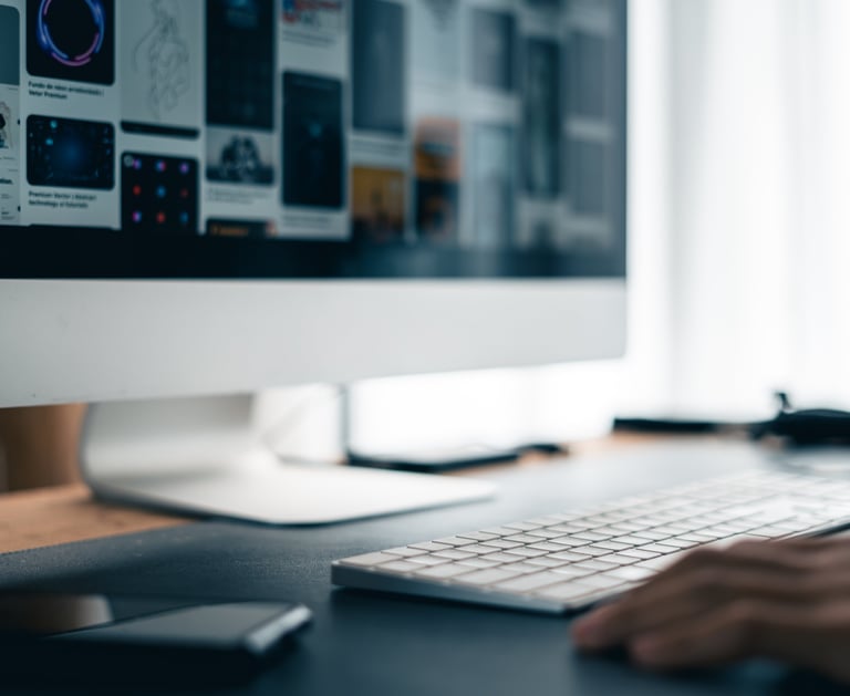 a person's hand is typing on a keyboard