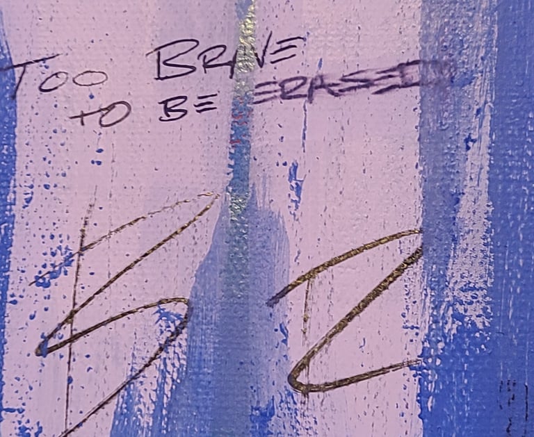 Part of a painting by artists Dwight White that says "Too Brave To Be Erased"
