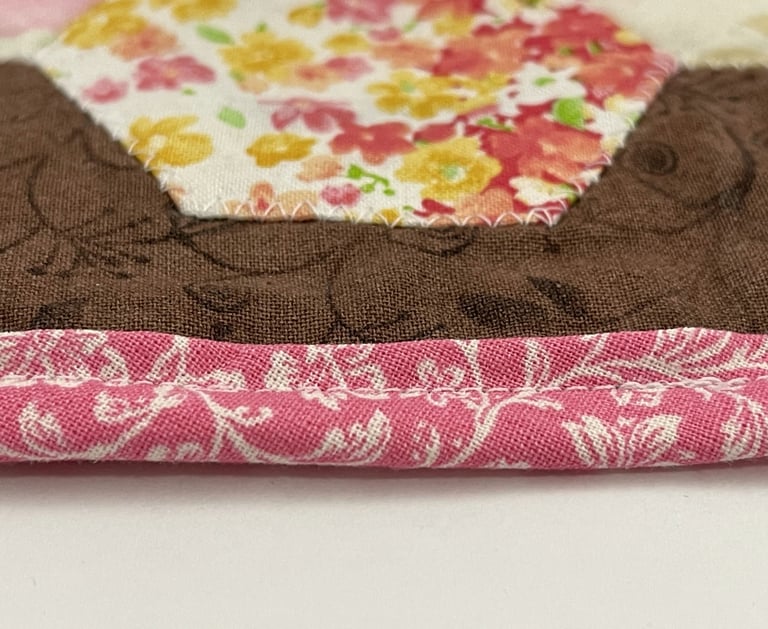 a close up of a piece of fabric with a flowered flower