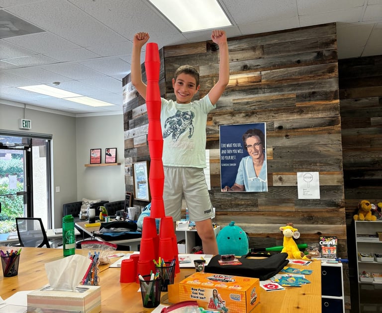 Excited boy who completed math project.