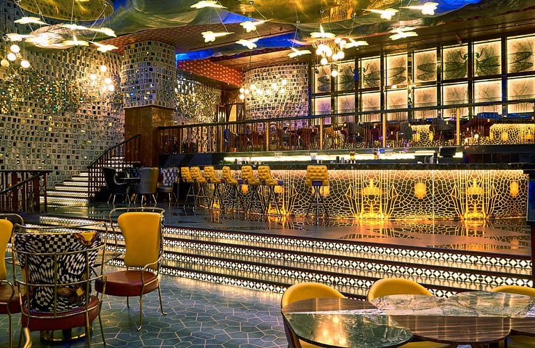 a bar with a bar with a bar stool and a bar with a bar stool