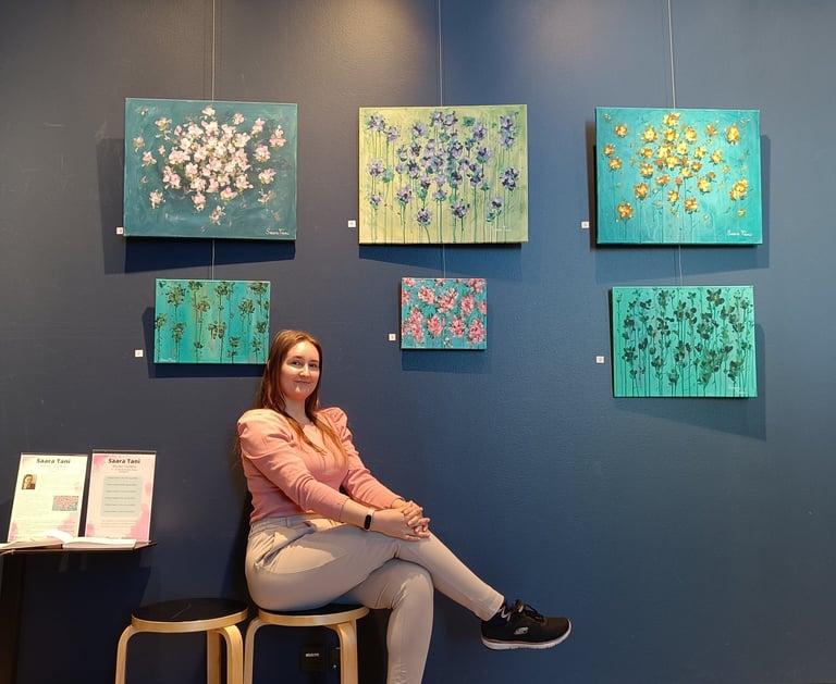 photo of the artist saara tani at her exhibition "divine garden" in september 2022