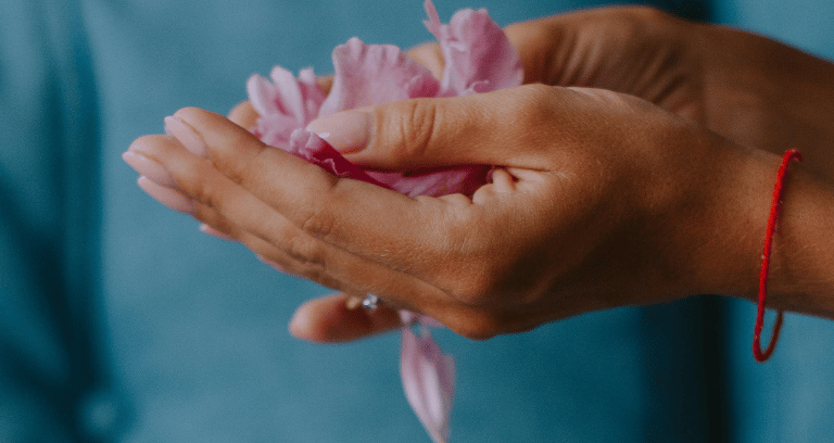 petals in woman's hand