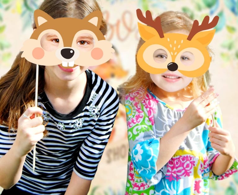 two girls in striped shirts and masks with deer faces